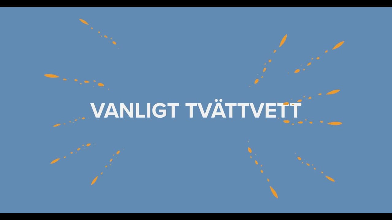 En tvättmaskin och en torktumlare. På väggen bredvid sitter en skylt med texten "Rätt sak på rätt plats" och städutrustning i hållare.