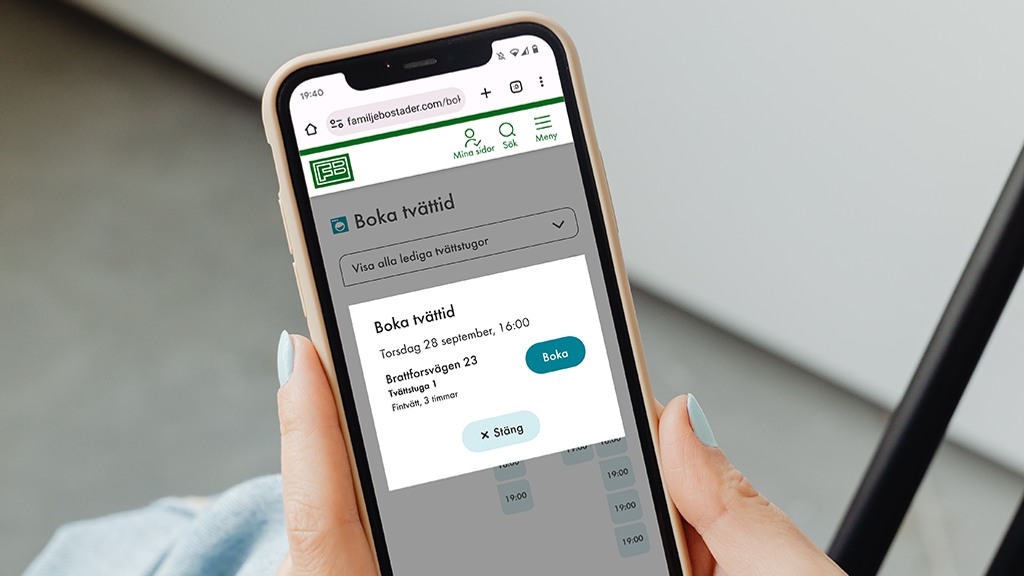 Mobiltelefon med Familjebostäders e-tjänst 